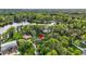 Captivating aerial shot of a residential property nestled amongst lush greenery at 3620 Little Rd, Lutz, FL 33548