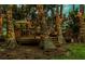 Backyard wooden deck features elegant lighting and outdoor furniture at 3620 Little Rd, Lutz, FL 33548