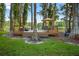 Backyard deck featuring lake view and seating area with umbrella at 3620 Little Rd, Lutz, FL 33548