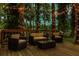 Cozy backyard deck with stylish furniture and string lights creating a warm and inviting outdoor space at 3620 Little Rd, Lutz, FL 33548