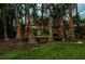 Backyard wooden deck features elegant lighting and outdoor furniture at 3620 Little Rd, Lutz, FL 33548