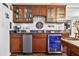 Wet bar with wine fridge and coffee maker conveniently located off the game room at 3620 Little Rd, Lutz, FL 33548