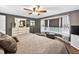 Comfortable bedroom with a ceiling fan, bay window, and lots of natural light at 3620 Little Rd, Lutz, FL 33548