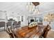 Dining area featuring a wooden table, barstool seating and views of the kitchen and living room at 3620 Little Rd, Lutz, FL 33548
