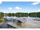 Inviting lake view from the dock, complete with lounge chairs for relaxing and enjoying the serene surroundings at 3620 Little Rd, Lutz, FL 33548