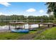 Lakefront dock with kayaks ready for a relaxing day on the water at 3620 Little Rd, Lutz, FL 33548