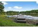 Picturesque dock with kayaks nearby, offering direct access to the beautiful lake at 3620 Little Rd, Lutz, FL 33548