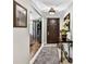 Foyer with tile flooring, complemented by decor, providing a welcoming entrance into the home at 3620 Little Rd, Lutz, FL 33548