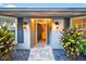 Inviting entryway with a stone path and decorative plants, leading to a warm and welcoming home at 3620 Little Rd, Lutz, FL 33548