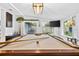 Game room with a pool table and plenty of natural light from multiple windows at 3620 Little Rd, Lutz, FL 33548