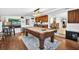Spacious game room with access to the kitchen and other living areas in the home at 3620 Little Rd, Lutz, FL 33548