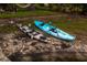Two kayaks resting near a waterfront area, perfect for outdoor adventures at 3620 Little Rd, Lutz, FL 33548