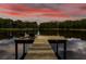 Lake view featuring a dock with lounge chairs, great for relaxing outdoors at 3620 Little Rd, Lutz, FL 33548