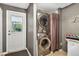 Functional laundry area with stacked washer and dryer, providing convenience at 3620 Little Rd, Lutz, FL 33548