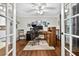 Bright office with a wooden desk, chair, and a view of the outdoors at 3620 Little Rd, Lutz, FL 33548