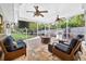 Relaxing covered patio with outdoor seating, a ceiling fan, and an outdoor kitchen at 3620 Little Rd, Lutz, FL 33548
