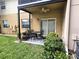 Relaxing covered patio with outdoor seating, ideal for enjoying the serene backyard at 3810 N Oak Dr # N31, Tampa, FL 33611