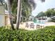 Beautiful community pool area surrounded by mature trees and lounge chairs, perfect for relaxation and recreation at 3810 N Oak Dr # N31, Tampa, FL 33611