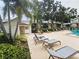 Community pool and sundeck offering ample seating and shade structures, ideal for relaxation and social gatherings at 3810 N Oak Dr # N31, Tampa, FL 33611