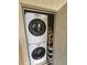 Efficient laundry closet with stacked washer and dryer units, maximizing space at 3810 N Oak Dr # N31, Tampa, FL 33611