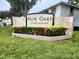 Exterior view of condo entrance sign surrounded by manicured landscaping at 3810 N Oak Dr # N31, Tampa, FL 33611