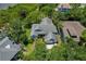 Beautiful home with a large roof and mature landscaping, situated near a body of water at 389 Grand Bay Dr, Palm Harbor, FL 34683