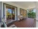 Enjoy seamless indoor-outdoor living with sliding doors opening onto a charming back porch at 389 Grand Bay Dr, Palm Harbor, FL 34683