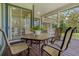 Enjoy outdoor dining on the back porch, overlooking the lush yard and tranquil surroundings at 389 Grand Bay Dr, Palm Harbor, FL 34683