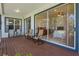 Covered back porch offers an extension of the living space with access to the beautiful outdoors at 389 Grand Bay Dr, Palm Harbor, FL 34683