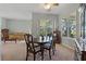Well-lit dining room, with ample seating, a large window, and a hutch at 389 Grand Bay Dr, Palm Harbor, FL 34683