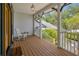Cozy porch with a rocking chair and a clear view of the front yard at 389 Grand Bay Dr, Palm Harbor, FL 34683