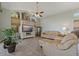 Bright living room featuring large windows, tile flooring, and comfortable seating at 389 Grand Bay Dr, Palm Harbor, FL 34683