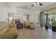 Open concept living room with tile flooring, white cabinets, and seamless transition to the kitchen at 389 Grand Bay Dr, Palm Harbor, FL 34683
