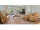 Comfortable living room with a ceiling fan and access to the outdoor balcony at 389 Grand Bay Dr, Palm Harbor, FL 34683