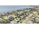 An aerial view of homes in a waterfront community with houses, trees, and a clear view of the water at 4015 Overlook Ne Dr, St Petersburg, FL 33703