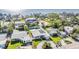 Breathtaking aerial view of waterfront property featuring lush greenery, solar panels, and serene water views at 4015 Overlook Ne Dr, St Petersburg, FL 33703