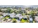 Aerial view of waterfront community with lush landscaping, solar panels, and a serene coastal setting at 4015 Overlook Ne Dr, St Petersburg, FL 33703