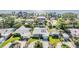 An aerial shot of a home with solar panels and a well-maintained yard in a tranquil neighborhood by the water at 4015 Overlook Ne Dr, St Petersburg, FL 33703