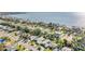 An aerial shot showcasing a scenic waterfront community with lush landscaping and diverse residential architecture at 4015 Overlook Ne Dr, St Petersburg, FL 33703