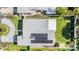 Overhead view of a home showing the roof, solar panels, and surrounding yard at 4015 Overlook Ne Dr, St Petersburg, FL 33703