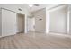 Spacious bedroom boasts light walls, trim and flooring, a ceiling fan and closet with sliding doors at 4015 Overlook Ne Dr, St Petersburg, FL 33703