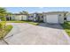 Charming single-story home with well-maintained landscaping, modern exterior, and spacious driveway at 4015 Overlook Ne Dr, St Petersburg, FL 33703