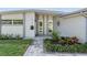 Inviting home entrance with manicured landscaping, modern exterior, and a brick walkway at 4015 Overlook Ne Dr, St Petersburg, FL 33703