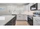 Modern kitchen featuring white cabinets, stainless steel appliances, and sleek countertops at 4015 Overlook Ne Dr, St Petersburg, FL 33703