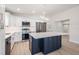 Bright, modern kitchen featuring white cabinets, stainless steel appliances, and a large island at 4015 Overlook Ne Dr, St Petersburg, FL 33703