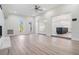 Bright living area with light wood floors, lots of natural light, and view to the kitchen at 4015 Overlook Ne Dr, St Petersburg, FL 33703