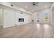 Living room featuring a fireplace, light wood floors, and ample natural light at 4015 Overlook Ne Dr, St Petersburg, FL 33703