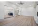 An open living room showing light flooring and views into the kitchen space at 4015 Overlook Ne Dr, St Petersburg, FL 33703