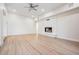 Bright living area with light wood floors and a modern fireplace at 4015 Overlook Ne Dr, St Petersburg, FL 33703