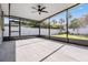 A screened patio with a ceiling fan, providing a great outdoor space for relaxation and entertainment at 4015 Overlook Ne Dr, St Petersburg, FL 33703